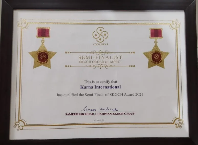 The framed SKOCH Award 2021 certificate: Karna International qualified for the semi-finals, SKOCH Order of Merit, signed by the chairman of SKOCH Group.